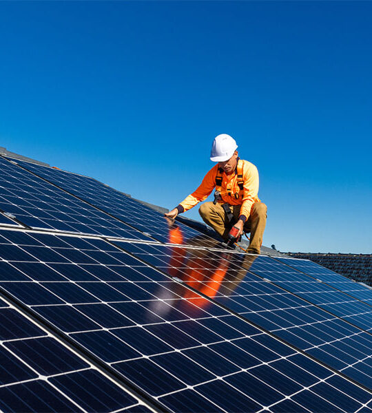 Man installing solar panels