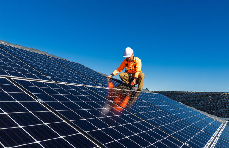 Man installing solar panels