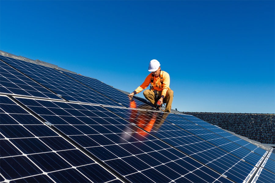 Man installing solar panels